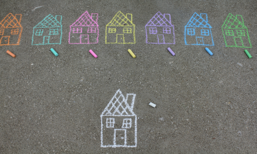 chalk drawing of 8 different houses in different colours